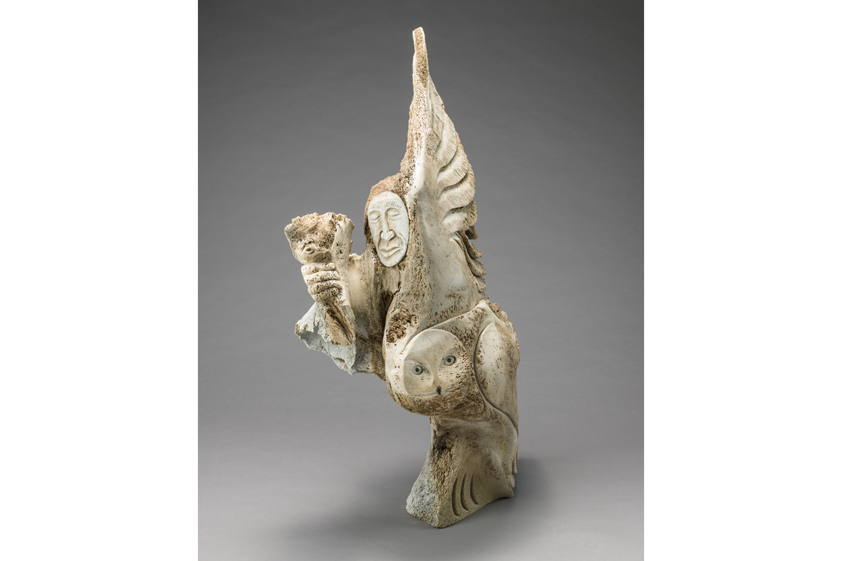 Manasie Akpaliapik, <em>The Sacred Owl</em>, about 2000. Whalebone, white stone and black African wonderstone, 106 x 62 x 43,5 cm. MNBAQ, promised gift of Lyse Burgoyne-Brousseau (DPD.2016.31) © Manasie Akpaliapik Photo: MNBAQ, Idra Labrie