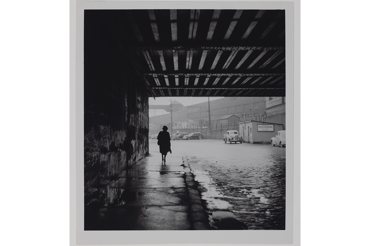 Paul-Marc Auger, <em>Woman Walking through an Underpass</em>, about 1940, gelatin silver print, 18.5 × 16.7 cm. Gift of Carl Auger, M2004.69.18, McCord Stewart Museum