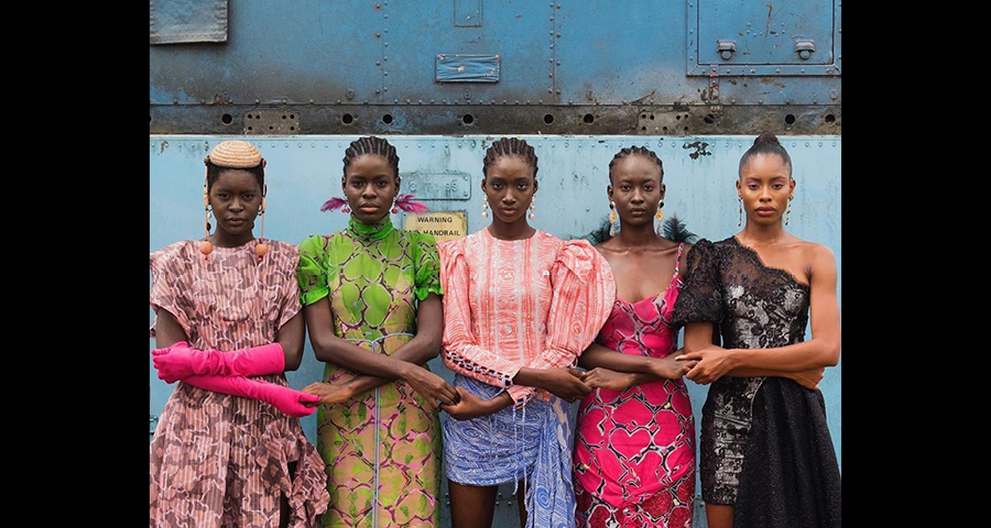 Models holding hands, Lagos, Nigeria, 2019 by Stephen Tayo. Courtesy of Lagos Fashion Week